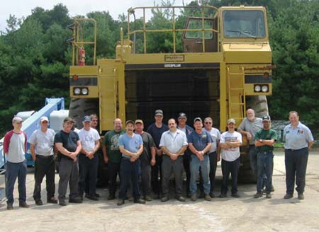 Receiving a catered lunch and Lowes gift cards for surpassing one year of work without any lost-time incidents are members of Vecellio & Grogans shop team, Beckley Equipment Repair. L to R: Steve Spencer, Dave Mullins, Alvin Jones, Marion Austin (behind Alvin), Gary Phillips, Bill Croy, Dave Johnson, Cecil Williams, Jimmy Jones, Jerry Hedrick, Jerry DiLorenzo, Darrell Payne, Jimmy Lilly, John Wickline, David Lilly, Jim Lowery, Calvin Lane and Alfred Lacy.  (Photo by Bob Kennedy)