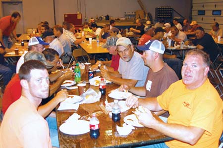 Enjoying a safety celebration at Sharpe Bros. are, in the foreground on the left, John Paul Evans and, on the right, Rod Powell, Ricky Saunders and Tim Bailey. (Photo by John Riley, Jr.)